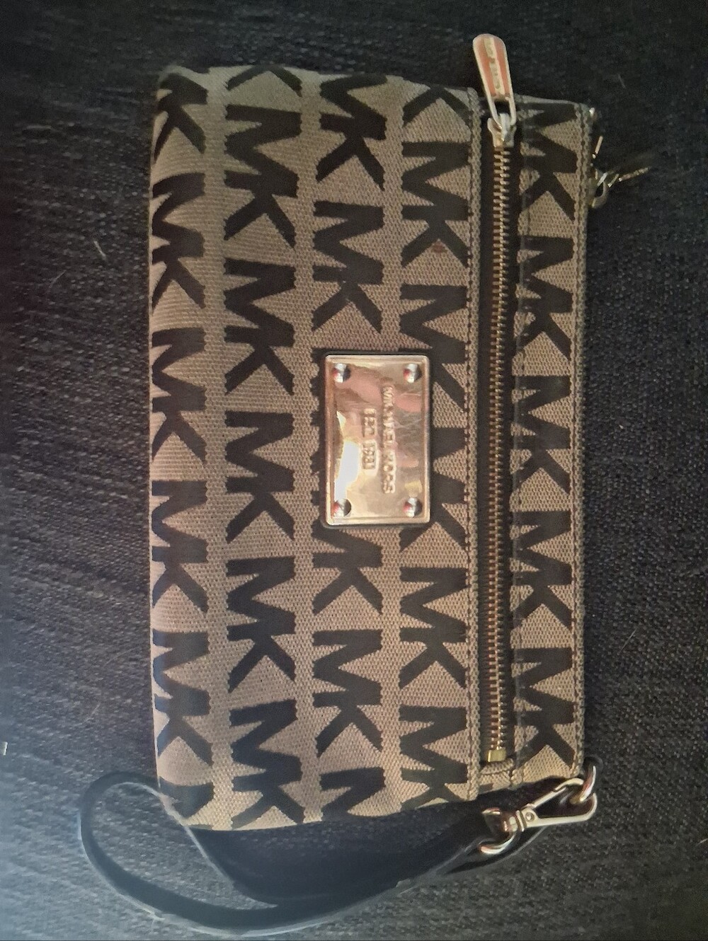 Michael Kors Black Logo Wristlet with Tan Background